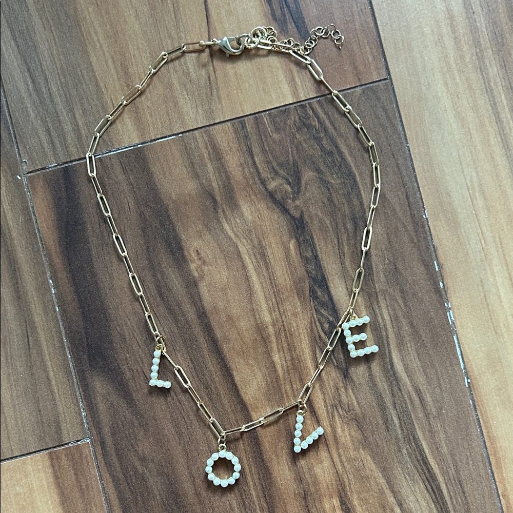 gold pearl “love” necklace